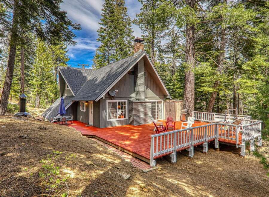 Nestled in a serene forest setting, this charming cabin offers a perfect blend of rustic charm and modern comfort.