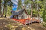 Nestled in a serene forest setting, this charming cabin offers a perfect blend of rustic charm and modern comfort.