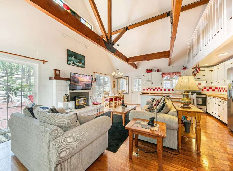 This stunning property boasts a cozy living room with a fireplace, perfect for relaxing evenings.