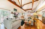 This stunning property boasts a cozy living room with a fireplace, perfect for relaxing evenings.