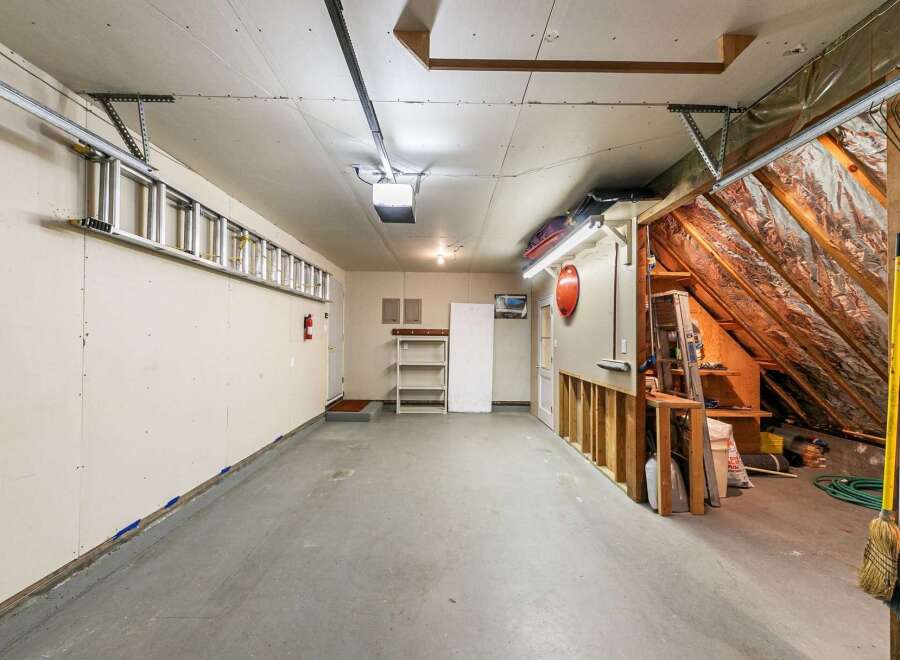 Step into this spacious garage, perfect for storage or a workshop.