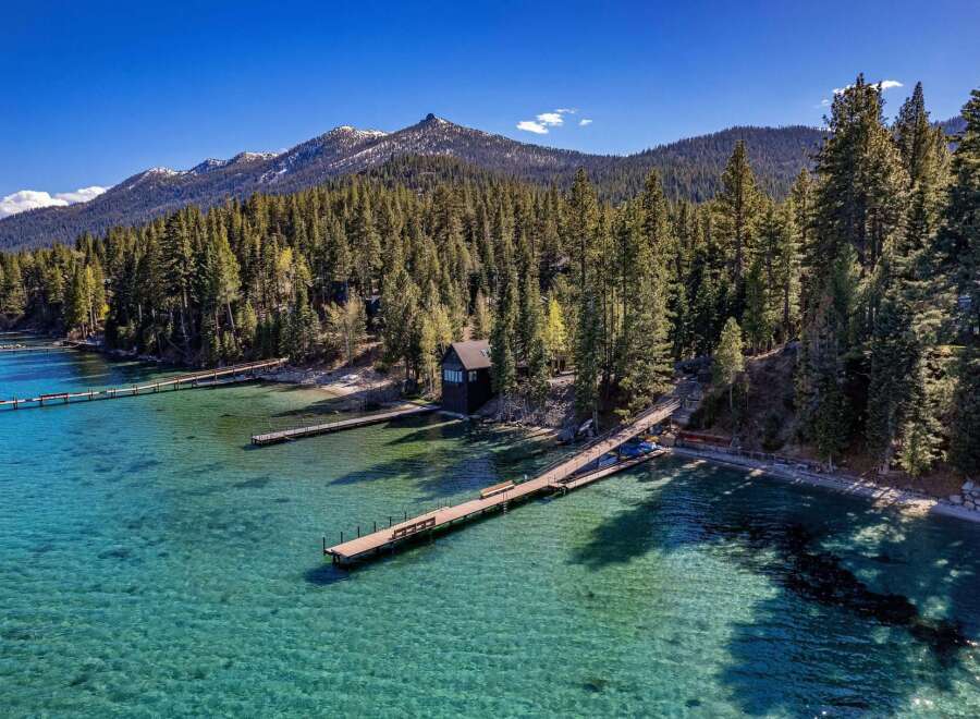 Discover a stunning waterfront property nestled amidst the serene beauty of nature.