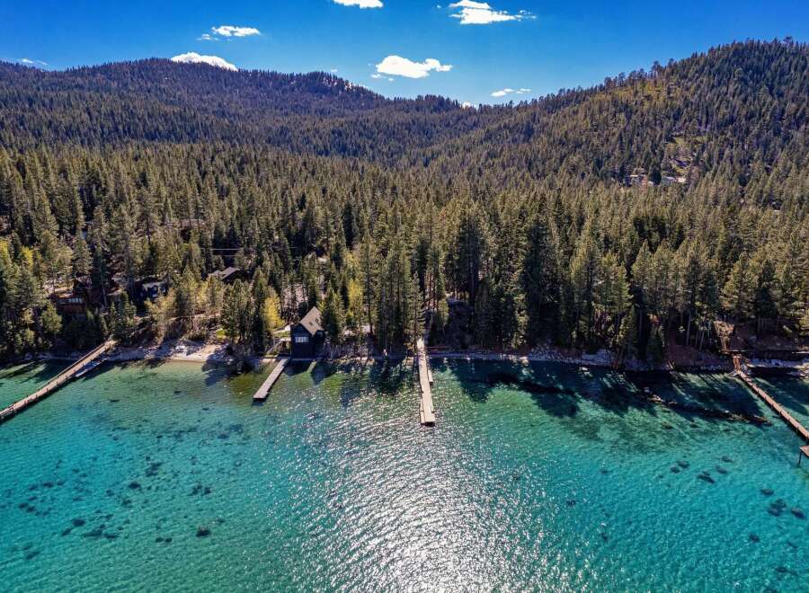 Discover your dream lakeside retreat! This stunning property boasts a private dock, perfect for enjoying the crystal-clear waters.