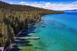 Discover your dream waterfront property! This stunning home boasts crystal-clear waters, private docks, and breathtaking views of the surrounding mountains.