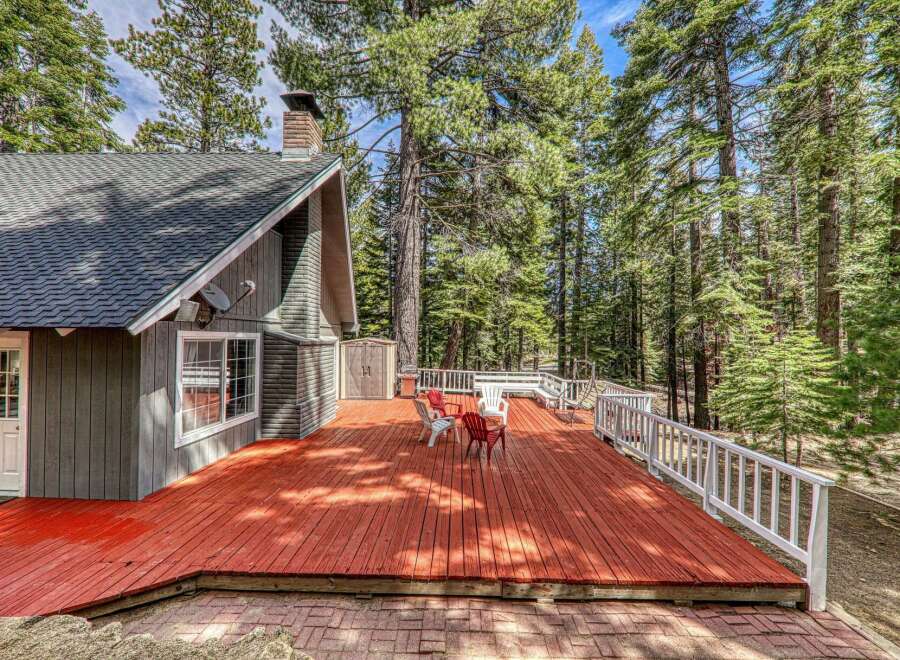 Escape to your dream retreat! This stunning property boasts a spacious deck, perfect for entertaining or relaxing amidst nature's beauty.