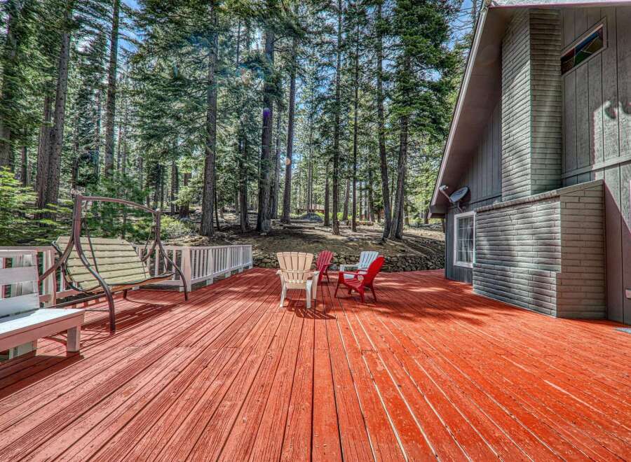 Enjoy the tranquility of nature from this stunning property featuring a spacious deck perfect for entertaining or relaxing.