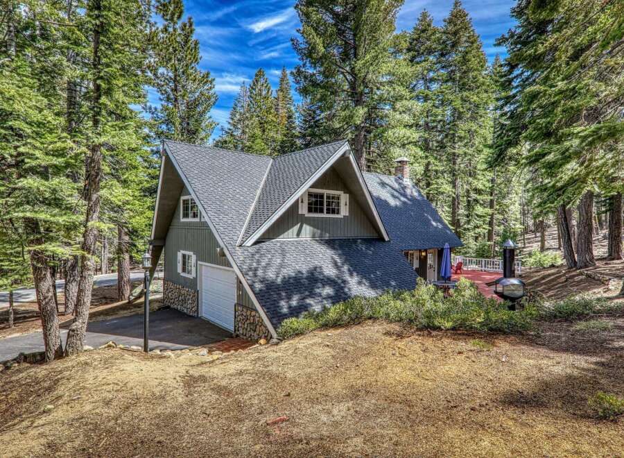 Nestled amidst towering trees, this charming cabin offers a serene escape.