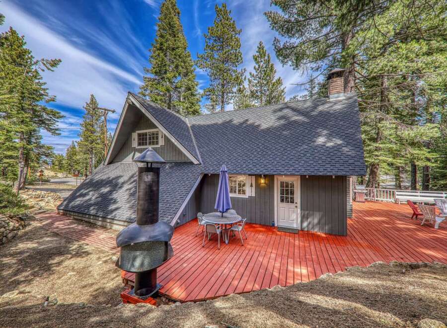 Nestled amidst towering trees, this charming cabin offers a serene escape.