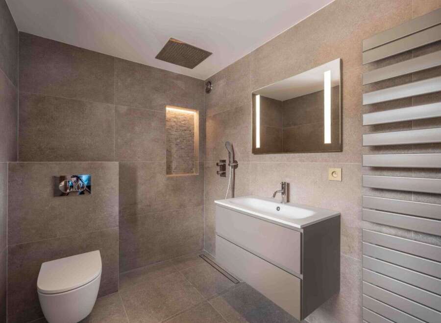 This modern bathroom features sleek design elements and high-end finishes.