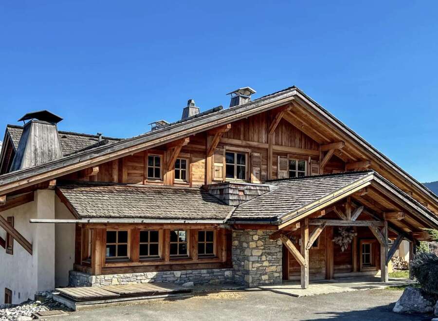 This stunning wooden chalet offers a luxurious mountain retreat with its charming architecture and inviting ambiance.