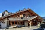 This stunning wooden chalet offers a luxurious mountain retreat with its charming architecture and inviting ambiance.