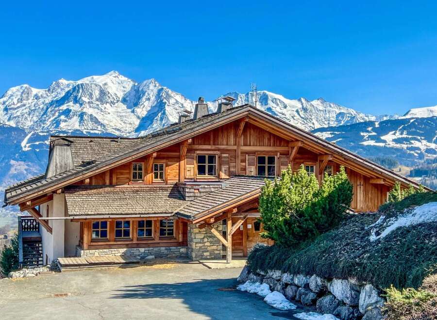 Nestled amidst the majestic snow-capped mountains, this stunning wooden chalet offers an idyllic retreat.