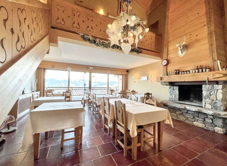 Step into a cozy and inviting restaurant with stunning mountain views.