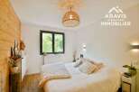 Discover the charm of this inviting bedroom, featuring a cozy ambiance and stylish design.