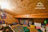 Discover a charming attic space perfect for a playroom or creative retreat.