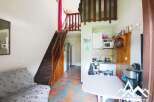 Discover this charming property featuring a cozy living space and a unique mezzanine level.