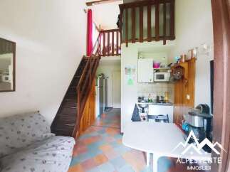 Discover this charming property featuring a cozy living space and a unique mezzanine level.