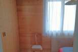 This cozy room features beautiful wooden paneling, creating a warm and inviting atmosphere.