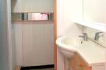 This well-maintained bathroom features a modern sink and a stylish vanity, perfect for daily routines.