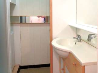 This well-maintained bathroom features a modern sink and a stylish vanity, perfect for daily routines.