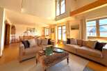 Step into luxury with this stunning living room, featuring a spacious layout and elegant design.