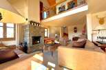 Experience luxury living in this stunning property featuring a cozy fireplace, perfect for chilly evenings.