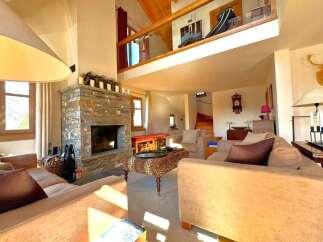 Experience luxury living in this stunning property featuring a cozy fireplace, perfect for chilly evenings.