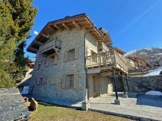 Discover the charm of this stunning stone-built property, featuring multiple balconies and a classic design.