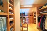 Step into luxury with this stunning walk-in closet, designed for both style and functionality.
