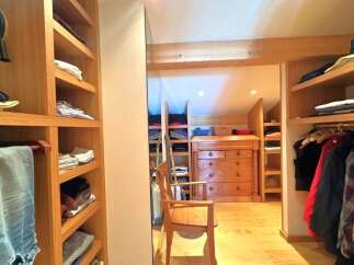 Step into luxury with this stunning walk-in closet, designed for both style and functionality.