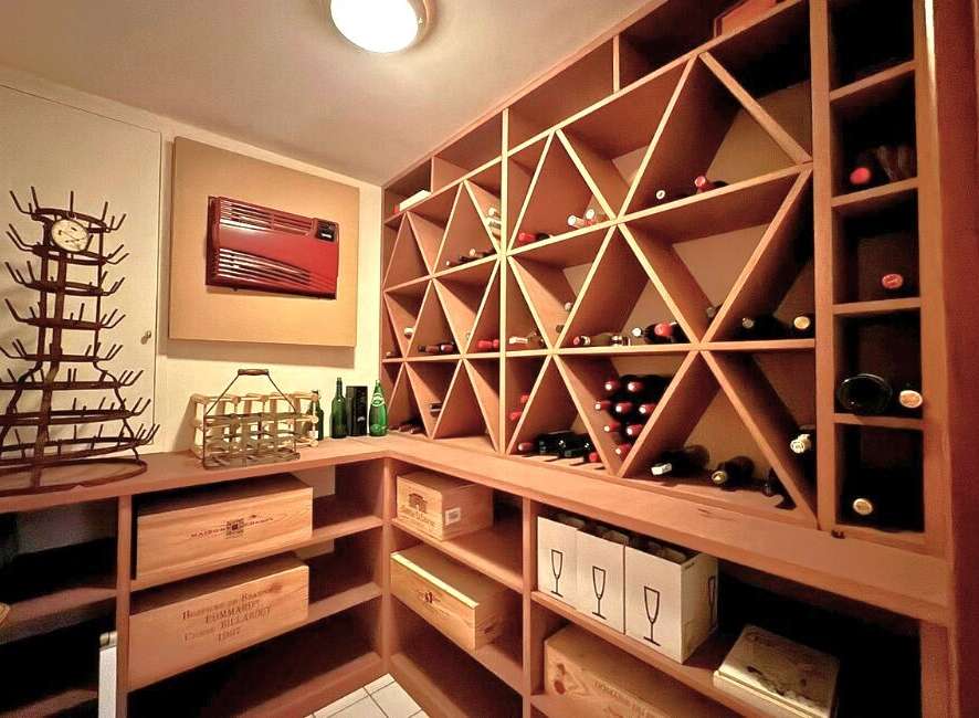 Discover the epitome of luxury living with this stunning property, featuring a dedicated wine cellar.