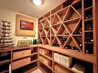 Discover the epitome of luxury living with this stunning property, featuring a dedicated wine cellar.