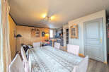 This charming property features a cozy dining area, perfect for gatherings.