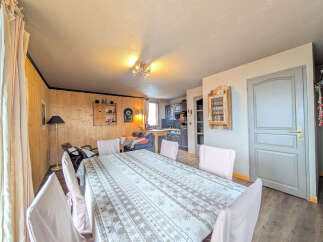 This charming property features a cozy dining area, perfect for gatherings.
