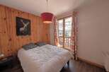 This cozy bedroom features a comfortable bed, perfect for a relaxing stay.