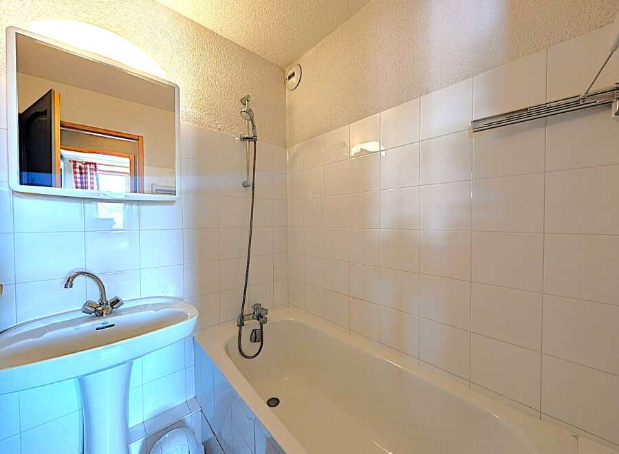 This bathroom features a clean and bright design, perfect for a relaxing space.