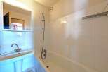 This bathroom features a clean and bright design, perfect for a relaxing space.