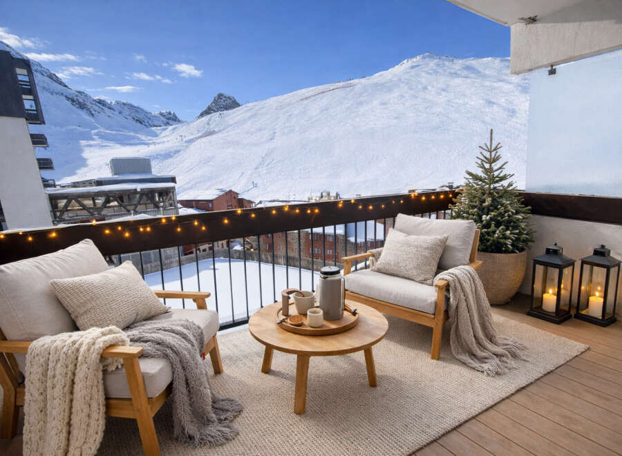 Enjoy breathtaking mountain views from this cozy balcony.