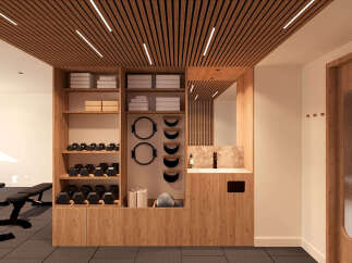 This modern gym features a sleek wooden ceiling with integrated lighting, creating a warm and inviting atmosphere.