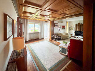 Step into luxury with this stunning property featuring a beautifully crafted wooden ceiling and elegant decor.