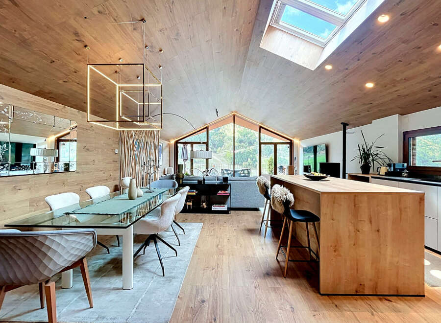 Experience luxury living in this stunning property featuring a modern kitchen with a stylish island and seating.