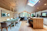 Experience luxury living in this stunning property featuring a modern kitchen with a stylish island and seating.