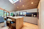 This stunning kitchen boasts a modern design with a warm, inviting atmosphere.