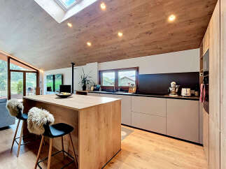 This stunning kitchen boasts a modern design with a warm, inviting atmosphere.