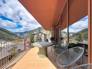 Enjoy breathtaking mountain views from this stunning property's expansive balcony.