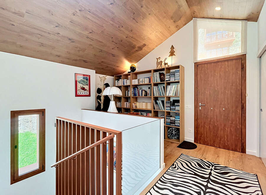 This stunning property boasts a unique architectural design with a cozy and inviting interior.