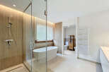 Step into luxury with this stunning bathroom featuring a modern design and high-end finishes.