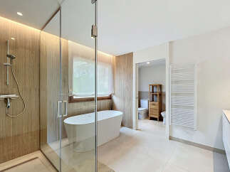 Step into luxury with this stunning bathroom featuring a modern design and high-end finishes.