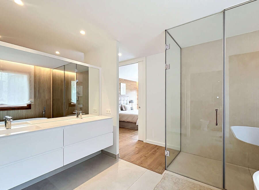 Step into luxury with this stunning bathroom, featuring a sleek, modern design.