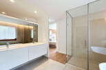 Step into luxury with this stunning bathroom, featuring a sleek, modern design.
